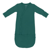 KYTE BABY Bundlers emerald sleeper gown with snaps for quick diaper changes.