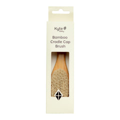 Kyte Baby cradle cap brush with goat hair bristles delivers gentle scalp massage.
