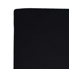 Kyte Baby crib sheet Midnight at bedside suggests easy night-time changes.