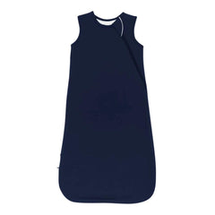 KYTE BABY sleep bag navy side view showing relaxed leg position for comfortable sleep