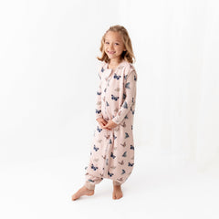 Kyte Baby sleep bag walker side view highlighting dual zipper for easy diaper changes on the go.