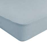 Kyte Baby Soft Crib Sheet Fog folded neatly, showcasing breathable bamboo fabric for easy nursery setup.