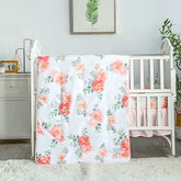 La Premura watercolor floral quilt displayed in pastel pink for baby girl nursery