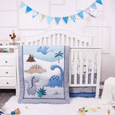 La Premura dinosaur quilt front featuring friendly dinos for bedtime cuddles.