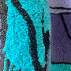 LAKEA Enthusiast racing-car rug embroidered center adds vibrant focal point in bedrooms.