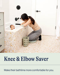 Lalo elbow rest with suction cups provides stable support during baby bath.