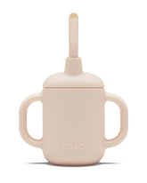 Lalo Little Cup grapefruit color close-up highlights safe silicone material for delicate gums