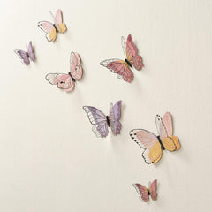Lambs & Ivy Butterfly Dreams black outlines accentuate intricate butterfly details on top layer.