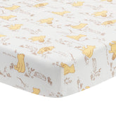 Lambs & Ivy Disney Baby Storytime Pooh sheet on crib mattress for breathable comfort.