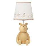 Lambs & Ivy Pooh 3D table lamp glows softly for nursery lighting.