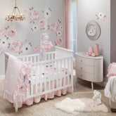 Lambs & Ivy Floral Garden quilt pink side provides cozy tactile feel for baby naps.