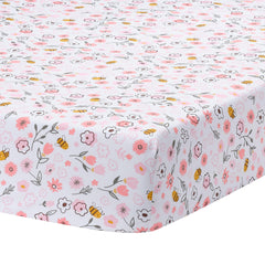 Lambs and Ivy Little Garden Sheet folded, pink floral fabric, soft breathable cotton for crib comfort.