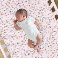 Lambs and Ivy Little Garden Sheet on mattress, secure elastic all around for a snug crib fit.