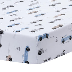 Lambs & Ivy Little Racer crib skirt with colored race cars elevates nursery decor.