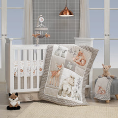 Lambs & Ivy Painted Forest knitted bear close-up highlighting cozy nursery appeal.