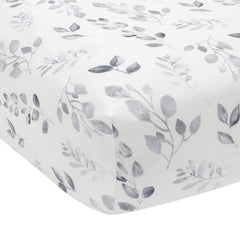 Lambs & Ivy Painted Forest crib sheet features gray watercolor leaves for a soft, coordinated nursery.