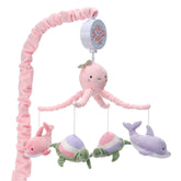 Lambs & Ivy Sea Dreams dolphins rotate above crib for gentle visual stimulation