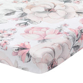 Lambs & Ivy Signature Botanical Baby Watercolor Crib Sheet in flatlay highlights a vibrant print for nursery decor.