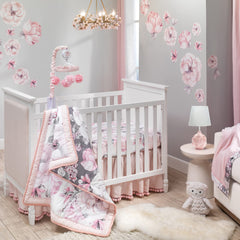 Lambs & Ivy Signature Botanical Baby Watercolor Crib Sheet folded and draped to show soft finish and drape.