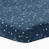 Lambs and Ivy Sky Rocket sheet closeup shows breathable cotton for baby comfort