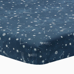 Lambs and Ivy Sky Rocket sheet closeup shows breathable cotton for baby comfort