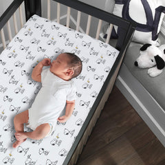 Lambs and Ivy Snoopy woodstock design closeup highlights playful detail for nursery charm.