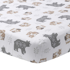 Lambs & Ivy Woodland Forest crib sheet close-up shows breathable cotton for comfortable sleep.