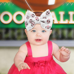 Lanmerry sequin glitter bow close-up highlighting sparkle for dressy baby looks.