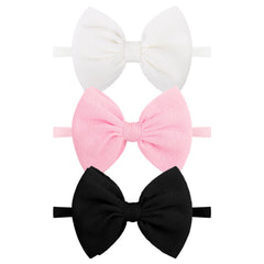 Lanmerry black baby bow headband on soft nylon stretch for comfortable daily wear.