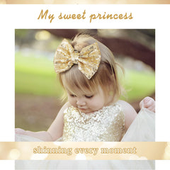 Lanmerry glitter gold hair bow close-up sequin detail highlights reversible sparkle effect.