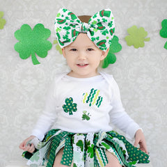 Lanmerry green shamrock bow on elastic headband for comfortable wear.