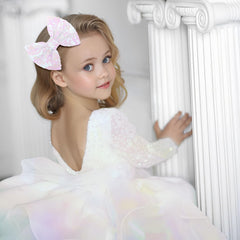 Lanmerry hair bow clip white sequin on hair showcases shiny finish for photos.