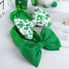 Lanmerry St. Patrick's Day top hat print bow adds playful party style.