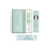 LatchLight wearable night light shows amber glow, aiding hands-free feeding without waking baby.
