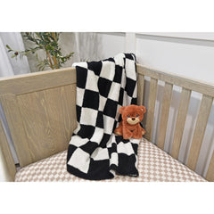 Leaps + Legends checkered blanket crib nursery decor adds timeless style