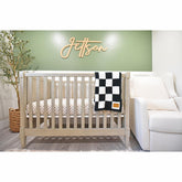 Leaps + Legends checkered blanket closeup shows ultra-soft fabric for cozy baby snuggles