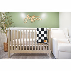 Leaps + Legends checkered blanket closeup shows ultra-soft fabric for cozy baby snuggles