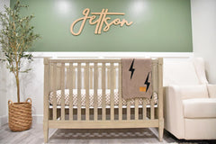 Leaps + Legends Lightning Bolt Blanket showing leather patch detail for lasting style
