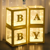 Ledido Baby Boxes showcase four gold balloon boxes ready as a centerpiece.