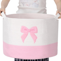 LemonRoad Pink Bow Extra Large Basket full of blankets for easy living room organization.