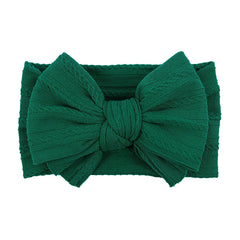 LemonSpace green headband closeup highlighting soft comfort for baby