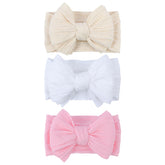 LemonSpace headband close-up bow in light pink, soft nylon for gentle wear