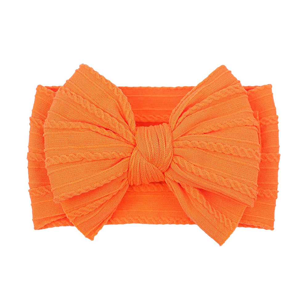 LemonSpace orange baby bow packaged for gifting and display