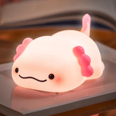 LettreQ axolotl night light on table with soft bedtime glow.