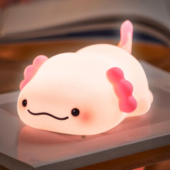 LettreQ axolotl night light on table with soft bedtime glow.