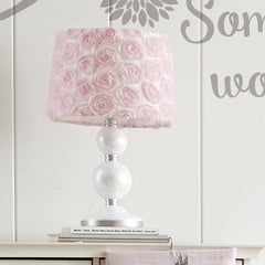Levtex Baby Elise pink rosette shade adds decorative softness and calming ambiance.