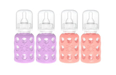 Lifefactory 4oz baby bottle with lavender sleeve provides secure grip for feeding.