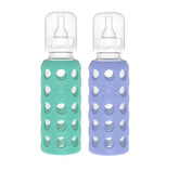 Lifefactory baby bottle 9oz kale-blueberry glass with silicone sleeve for secure grip.
