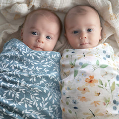 LifeTree baby swaddle in blue floral pattern demonstrates secure wrap for restful sleep.