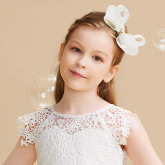 Liliebe cream bows clip closeup shows secure snap clip.